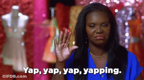 A Woman In A Blue Shirt Is Saying Yap , Yap , Yap , Yapping GIF