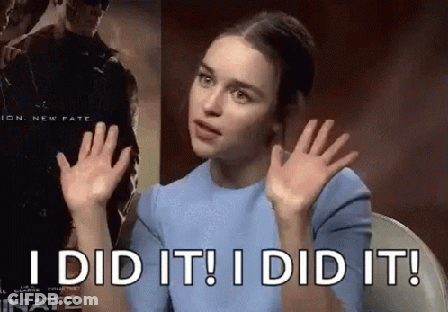 A Woman In A Blue Shirt Is Sitting In A Chair With Her Hands Up And Says `` I Did It ! '' GIF