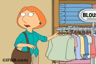 A Woman In A Blue Shirt Is Standing In Front Of A Sign That Says Blouses GIF