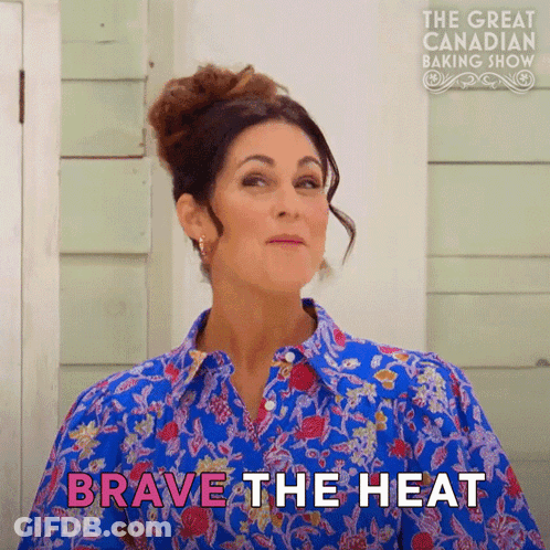A Woman In A Blue Shirt Says " Brave The Heat " In Pink GIF