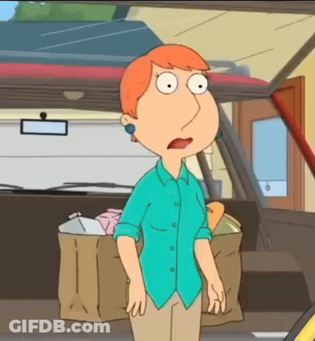 A Woman In A Blue Shirt Stands In Front Of A Car GIF