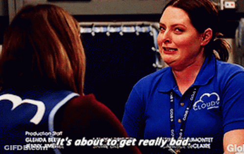 A Woman In A Blue Shirt That Says Clouds On It GIF