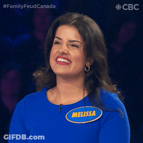 A Woman In A Blue Shirt With A Name Tag That Says Melissa GIF