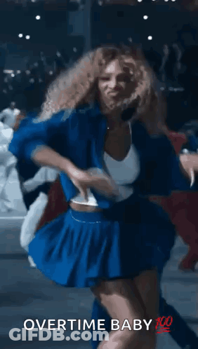 A Woman In A Blue Skirt Is Dancing With The Words Overtime Baby 100 Written On The Bottom . GIF