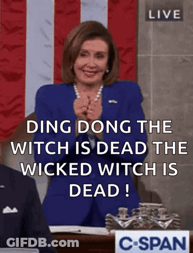 A Woman In A Blue Suit Says Ding Dong The Witch Is Dead GIF