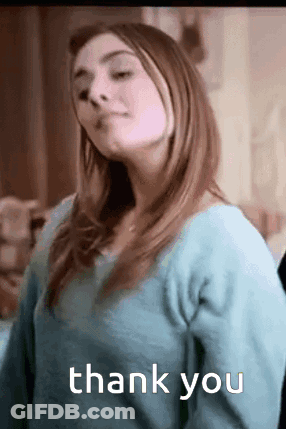A Woman In A Blue Sweater Is Giving A Thank You . GIF