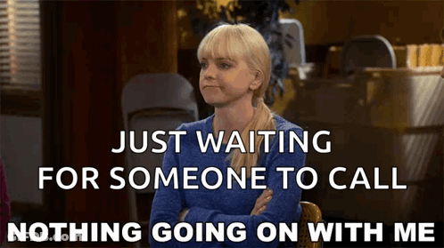 A Woman In A Blue Sweater Is Waiting For Someone To Call GIF