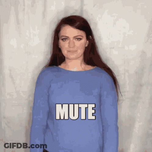 A Woman In A Blue Sweater Says Mute In White Letters GIF