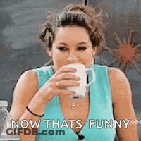 A Woman In A Blue Tank Top Is Drinking A Cup Of Coffee And Making A Funny Face . GIF