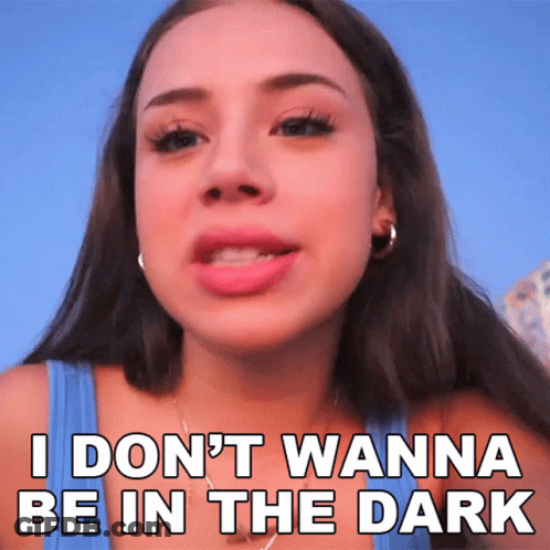 A Woman In A Blue Tank Top Says I Don 'T Wanna Be In The Dark GIF