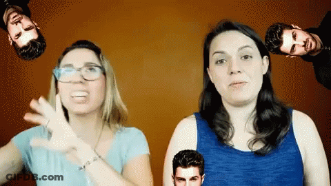 A Woman In A Blue Tank Top Stands Next To A Man GIF