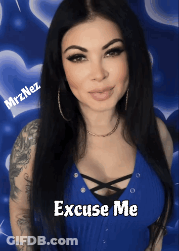 A Woman In A Blue Top With The Words Excuse Me On The Bottom GIF