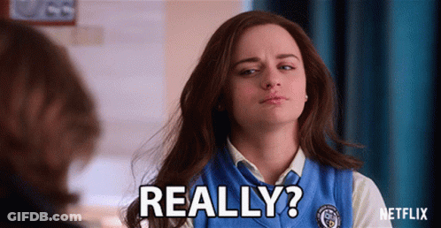 A Woman In A Blue Vest Says " Really " In Front Of A Man GIF