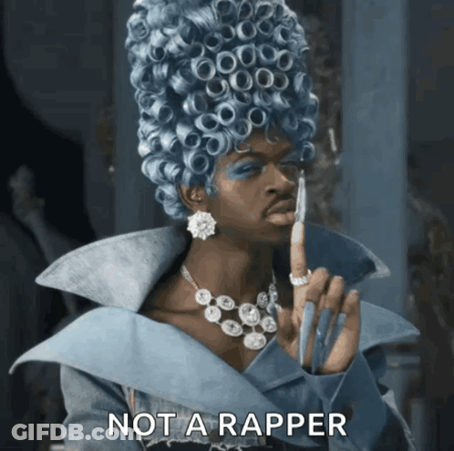 A Woman In A Blue Wig Says Not A Rapper In The Corner GIF