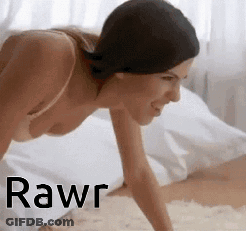 A Woman In A Bra Is Crawling On A Bed With The Word Rawr Written On The Bottom GIF