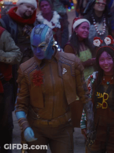 A Woman In A Brown Leather Jacket Has A Shield On Her Sleeve GIF