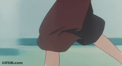 A Woman In A Brown Skirt And White Shoes Is Standing On A Green Floor GIF
