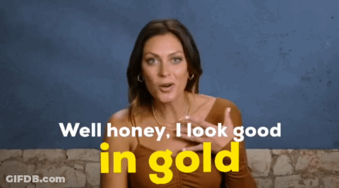 A Woman In A Brown Top Says Well Honey I Look Good In Gold GIF