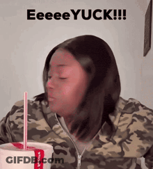 A Woman In A Camo Jacket Drinking From A Cup With A Straw And The Words Eeeeyuck GIF