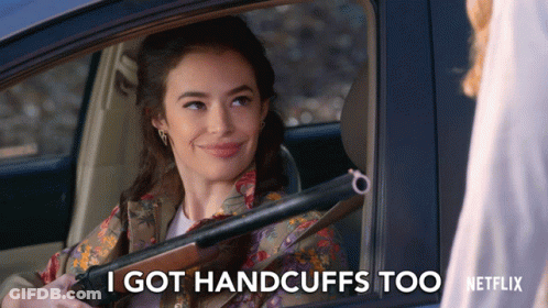 A Woman In A Car Holding A Shotgun Says I Got Handcuffs Too Netflix GIF