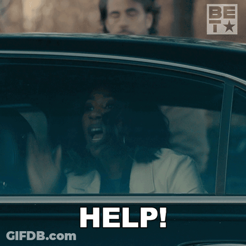 A Woman In A Car With Her Mouth Open And The Word Help Written On It GIF