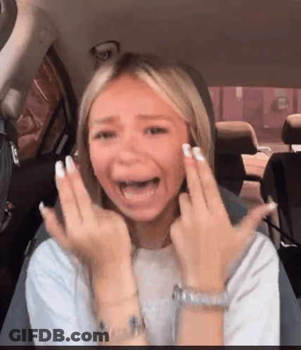 A Woman In A Car With Her Mouth Open GIF