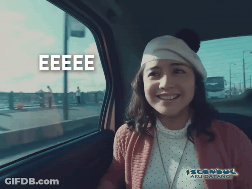 A Woman In A Car With Istanbul Aku Datangi Written On The Bottom Right GIF