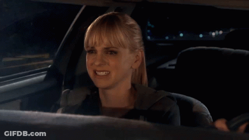 A Woman In A Car With Okay Well Written On The Bottom GIF