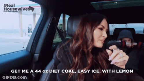 A Woman In A Car With The Words Get Me A 44 Oz Diet Coke Easy Ice With Lemon On The Bottom GIF