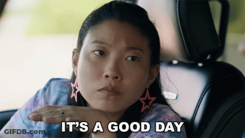 A Woman In A Car With The Words It 'S A Good Day Behind Her GIF