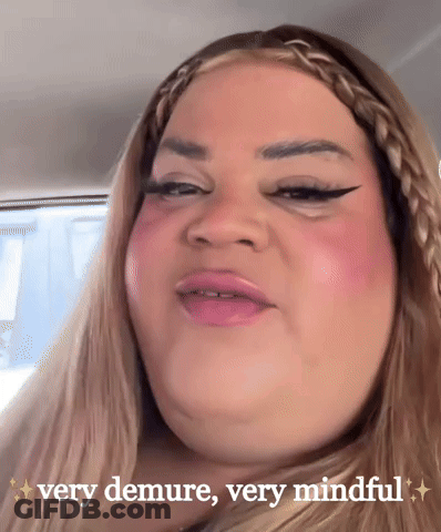 A Woman In A Car With The Words Very Demure Very Mindful Above Her GIF
