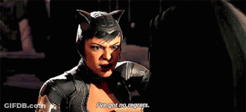 A Woman In A Catwoman Costume Is Talking To Another Woman . GIF
