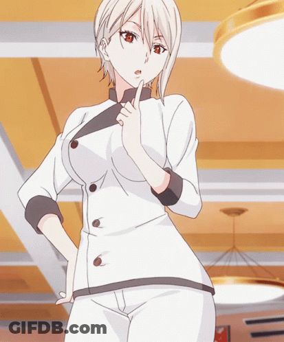 A Woman In A Chef 'S Uniform Is Standing With Her Hand On Her Chin GIF