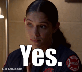 A Woman In A Chicago Fire Department Uniform Is Saying Yes GIF