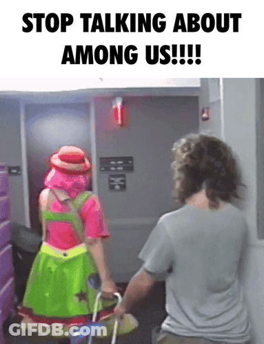 A Woman In A Clown Costume Is Pushing A Man In A Wheelchair With The Caption " Stop Talking About Among Us " GIF