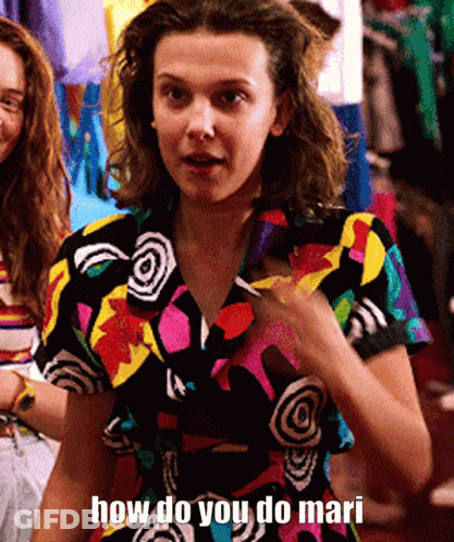 A Woman In A Colorful Shirt Is Asking How Do You Do Mari . GIF