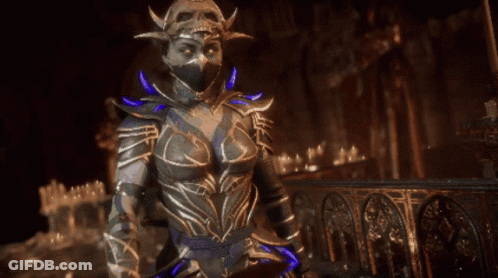 A Woman In A Costume Is Holding A Blue Object GIF