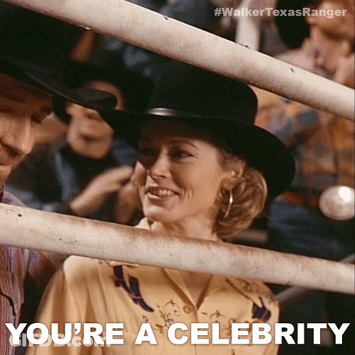 A Woman In A Cowboy Hat Is Behind A Fence And The Caption Says You 'Re A Celebrity GIF