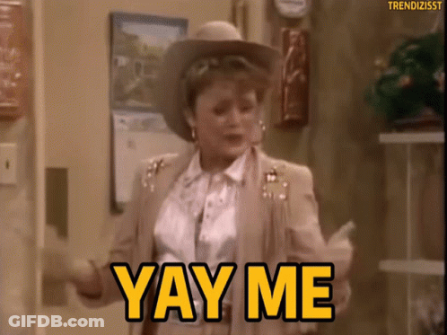 A Woman In A Cowboy Hat Is Dancing And Saying Yay Me GIF