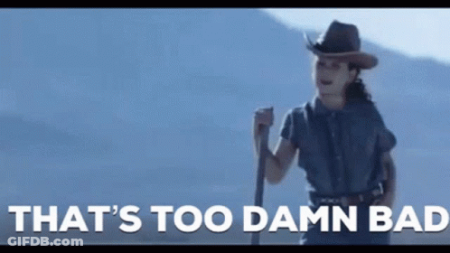A Woman In A Cowboy Hat Is Holding A Stick With The Words That 'S Too Damn Bad Written Below Her GIF