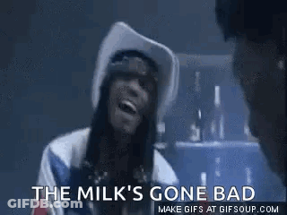 A Woman In A Cowboy Hat Is Smoking A Cigarette And Says `` The Milk 'S Gone Bad `` . GIF