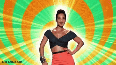 A Woman In A Crop Top And A Red Skirt Is Standing In Front Of A Colorful Circle . GIF
