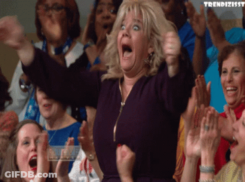 A Woman In A Crowd With The Word Trendizissy Written On The Bottom GIF