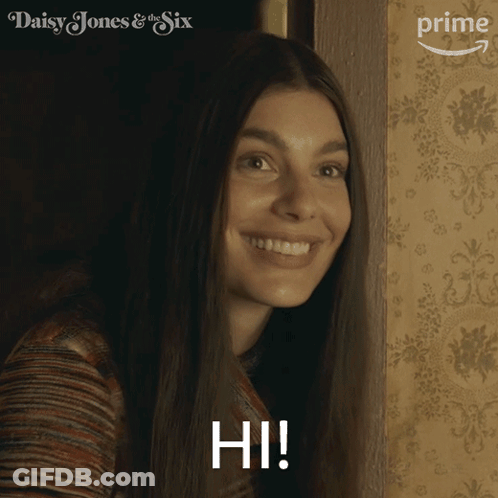 A Woman In A Daisy Jones & The Six Advertisement GIF