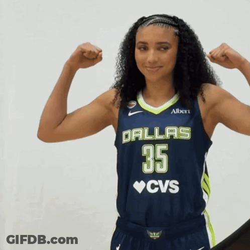 A Woman In A Dallas 35 Cvs Jersey Flexes Her Muscles GIF