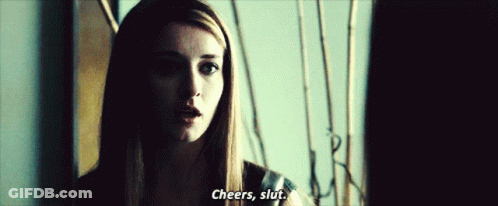 A Woman In A Dark Room Says Cheers , Slut GIF