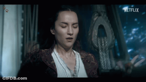 A Woman In A Dark Room With A Netflix Logo On The Bottom GIF