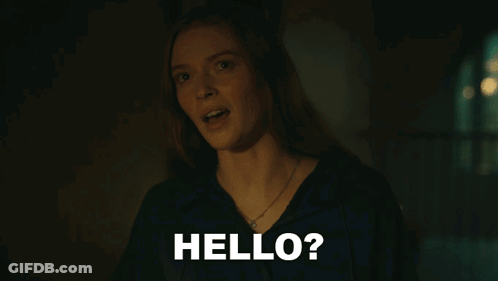 A Woman In A Dark Room With The Words Hello On The Bottom GIF