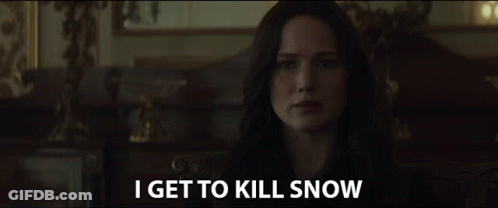A Woman In A Dark Room With The Words I Get To Kill Snow Above Her GIF