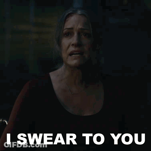 A Woman In A Dark Room With The Words I Swear To You On The Bottom GIF